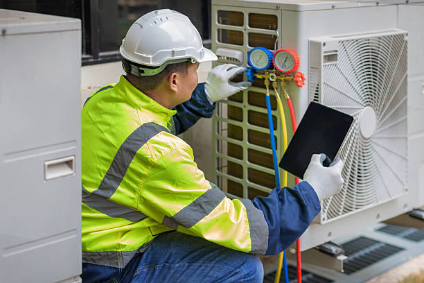 Professional Air Conditioning Repair technician working in Mayville, ND
